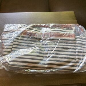 Overnighter bag from DSW. NWT. Black and white stripe with tan accents.
